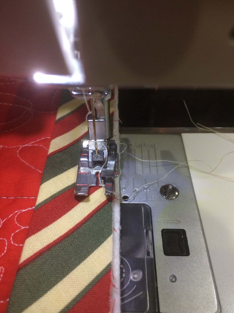 Binding and presser foot alignment when quilt is trimmed 1/8" outside the quilt top.