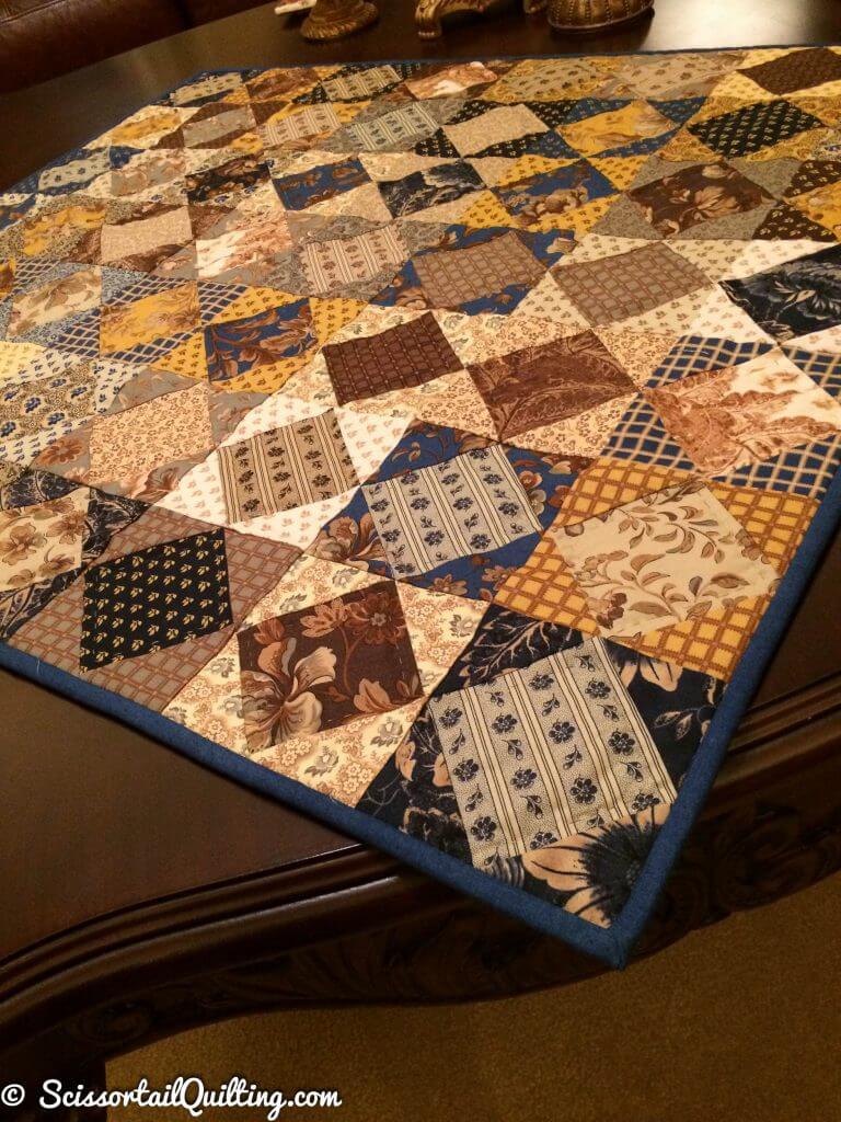traditional indigo and cheddar colored quilt with square in a square blocks