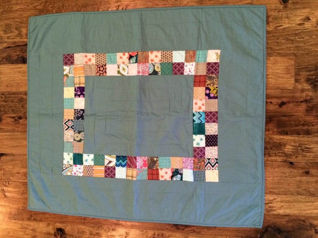 simple quilt made with small squares