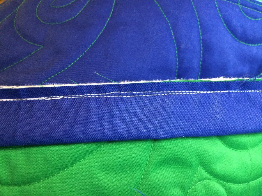 Photo of quilt showing a corrected stitching line