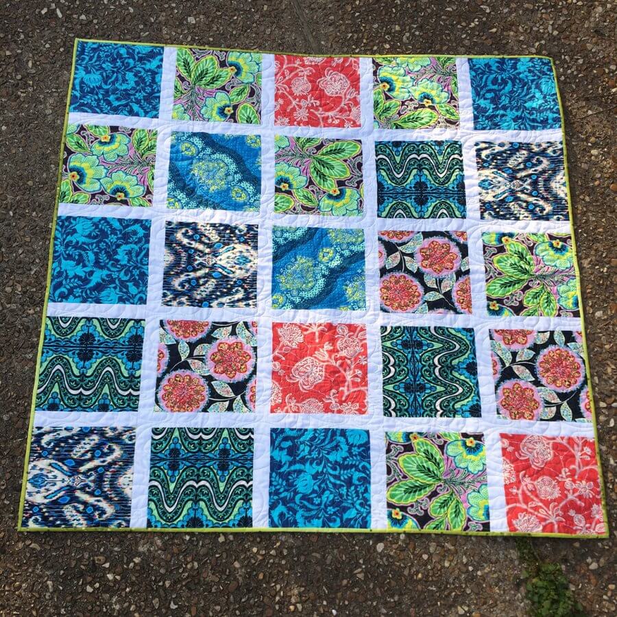 Completed quilt using Amy Butler fabrics