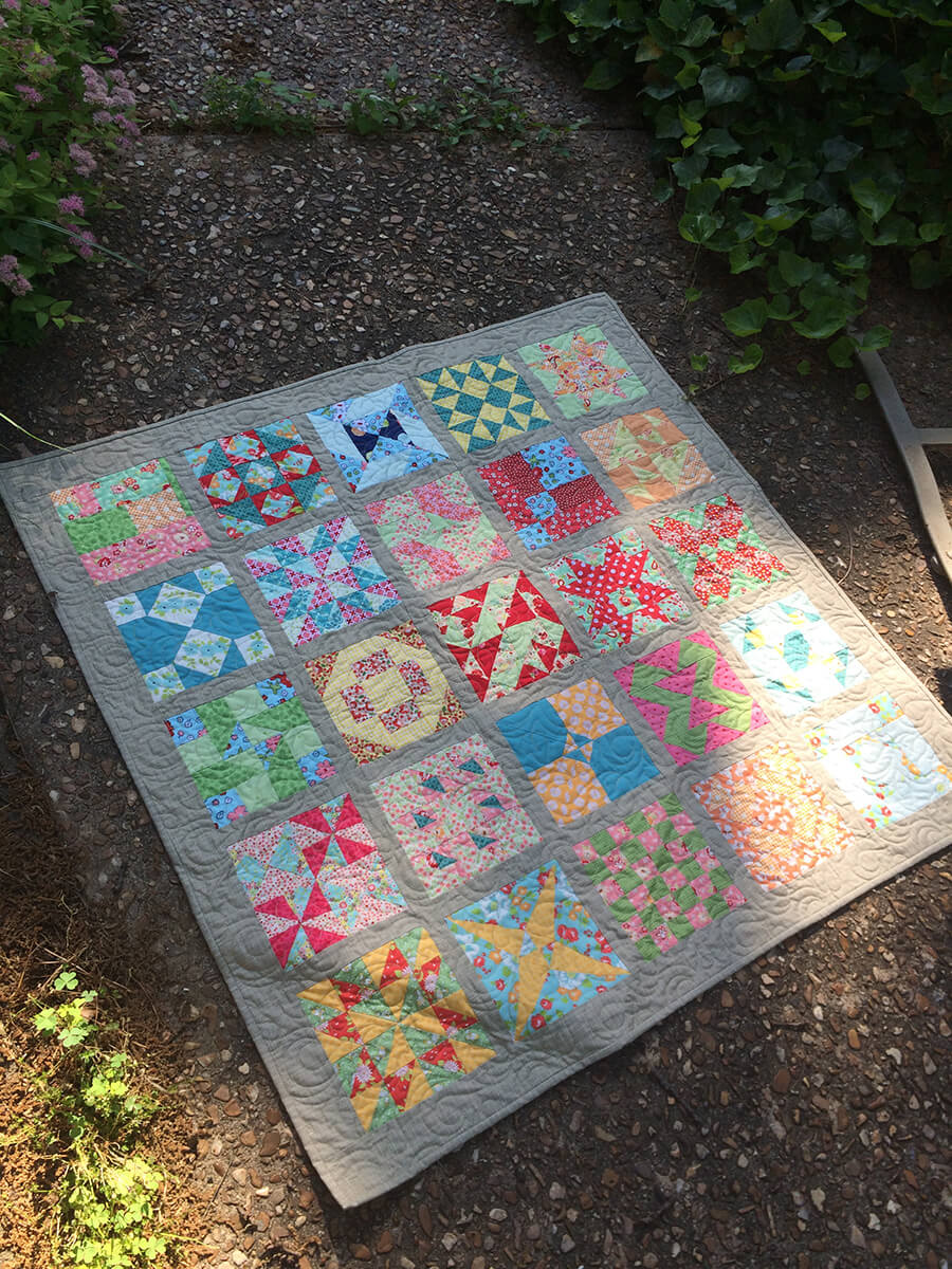 Photo of 1930s Farmer's Wife Sampler Baby Quilt by Scissortail Quilting - full view of front