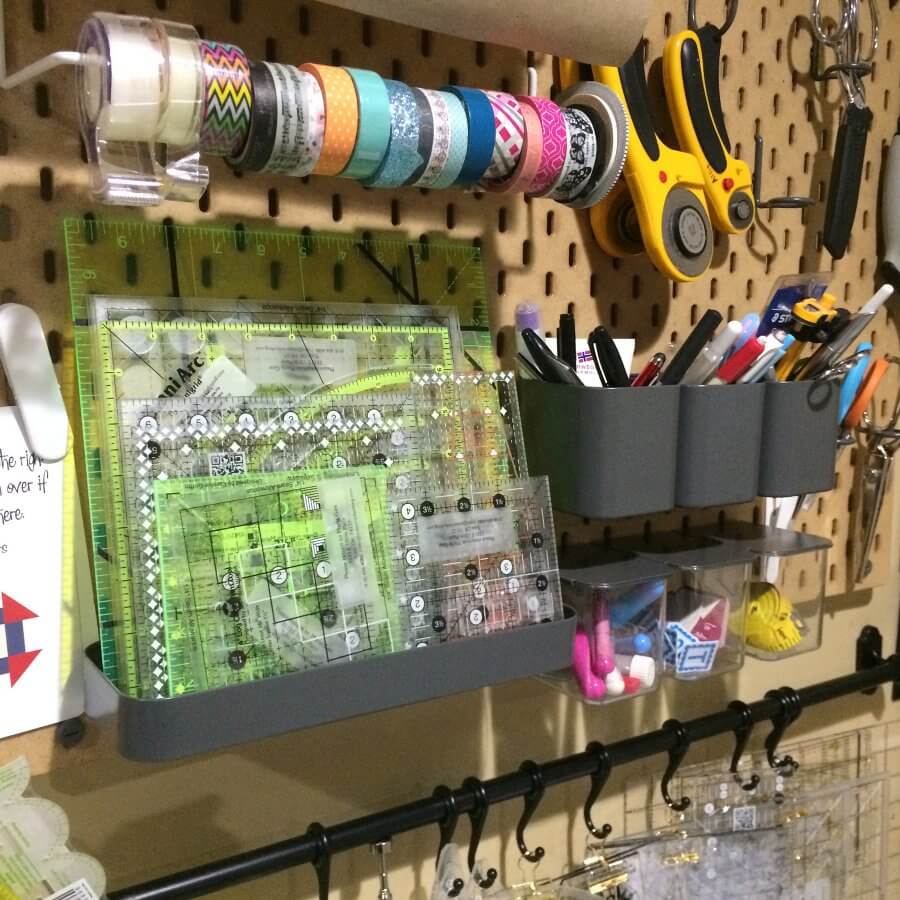Close up photo of peg board in a sewing room