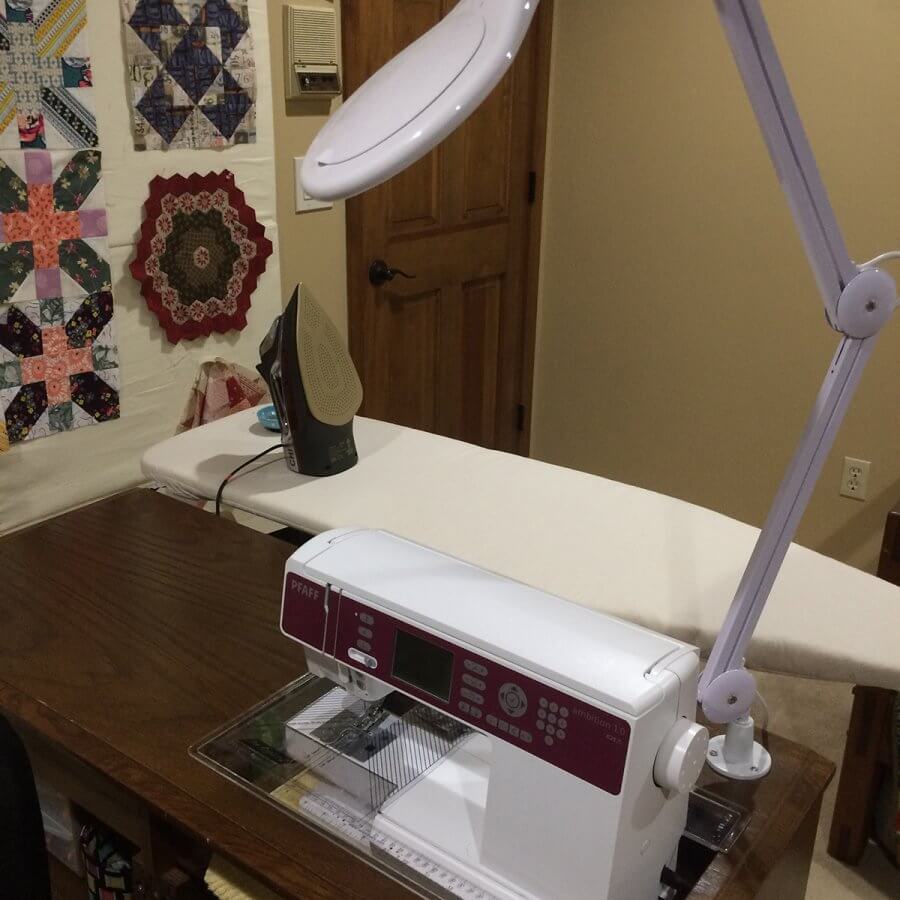 Photo of a sewing machine sitting in a cabinet