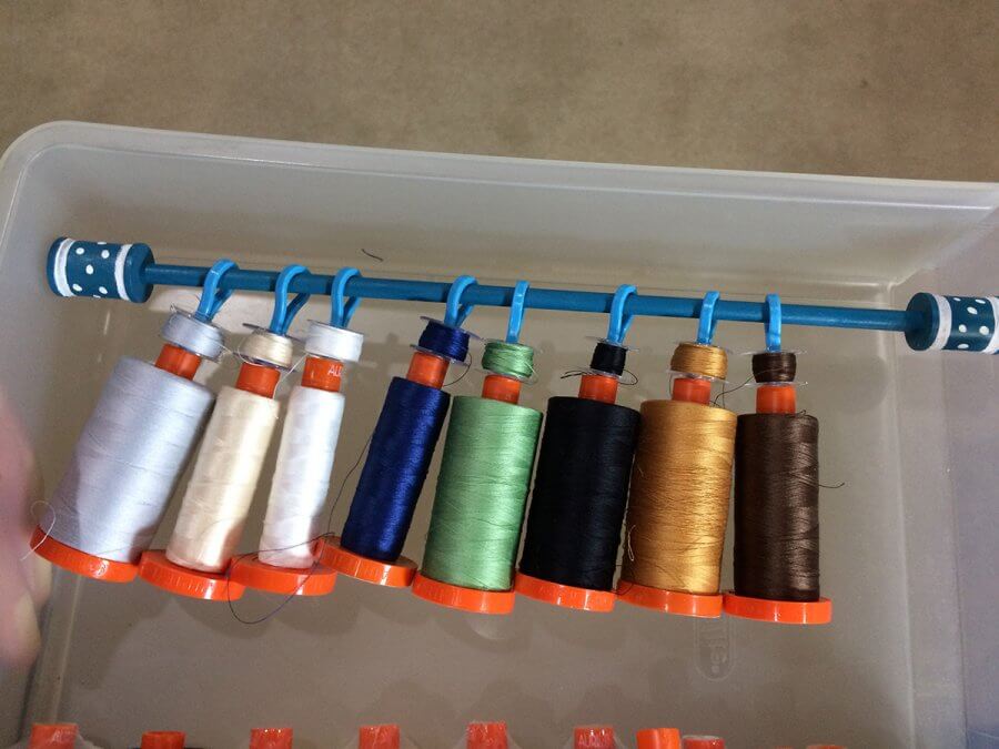 Photo of Thread spools contained on a dowel