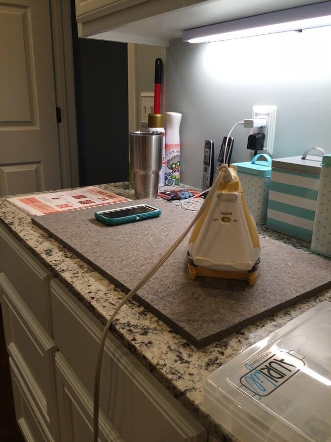 Photo of wool pressing mat and iron sitting on counter