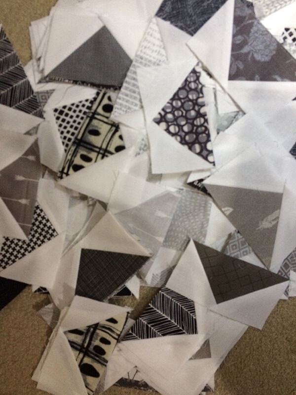 Photo of many black and gray Flying Geese Quilt block unites