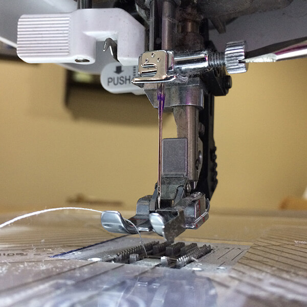 photo showing needle screw on a sewing machine