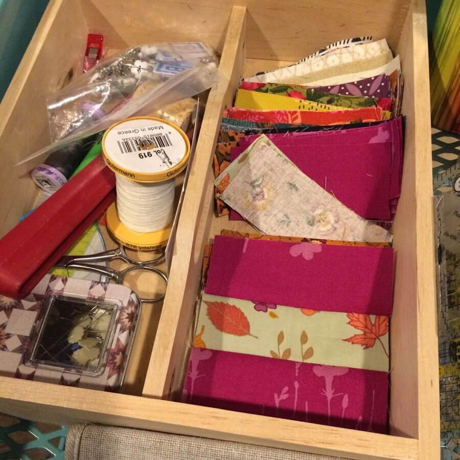 picture of sewing notions and test strips in a wooden box
