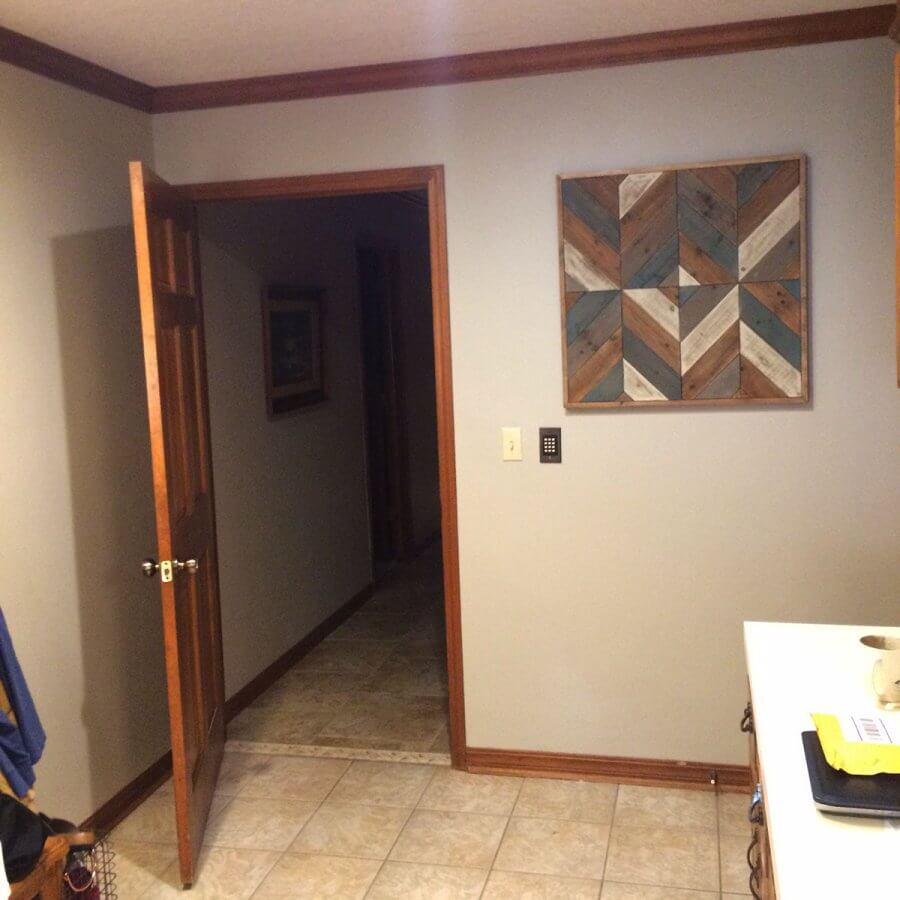 Photo of a barn quilt hanging inside a home