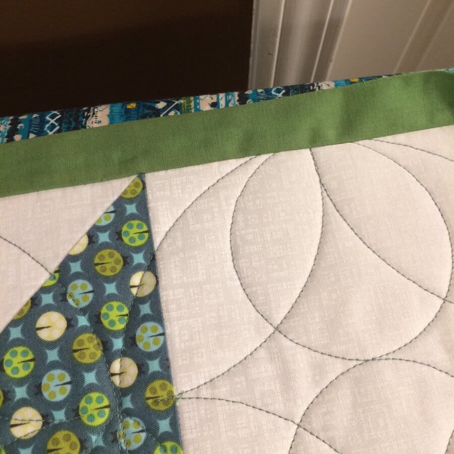 Photo of quilt with binding pressed out