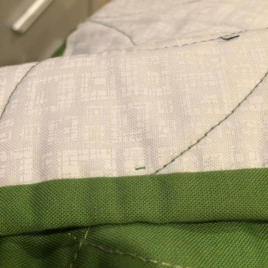 Photo showing a Peekaboo thread made when sewing binding