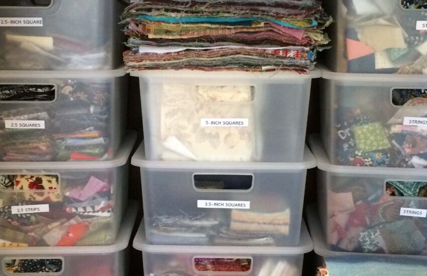 Photo of plastic bins containing scrap fabrics