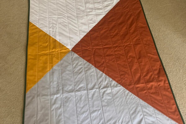 Baby Quilt made of four connecting triangles